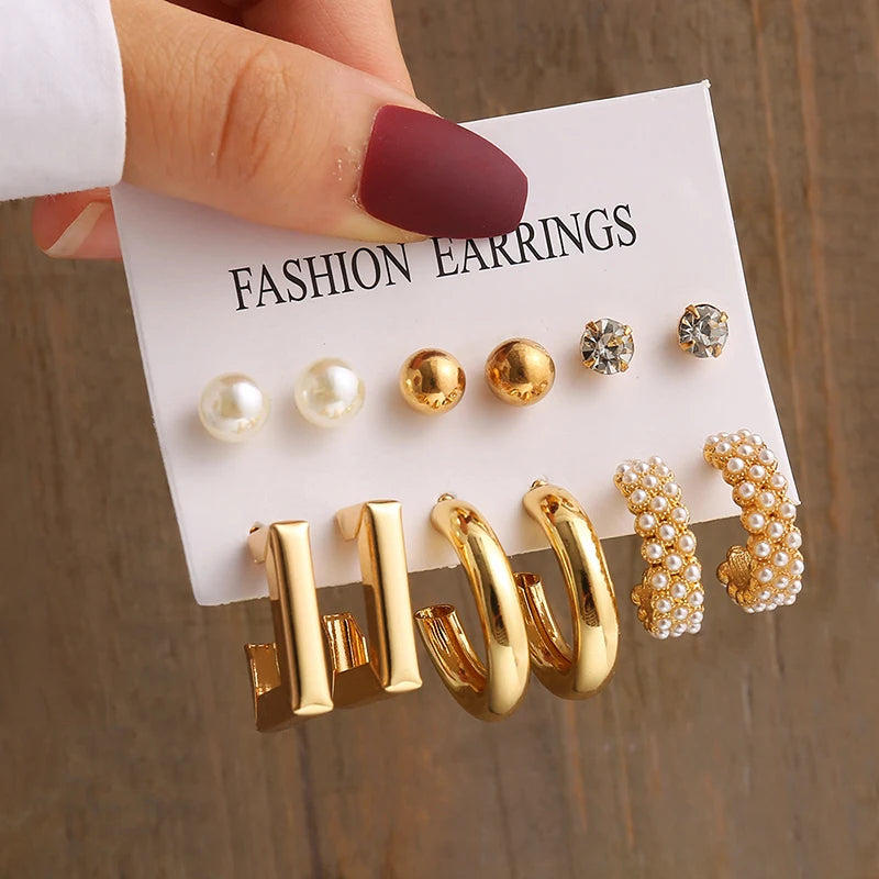 Gold geometric pearl earrings, trendy and party-ready.
