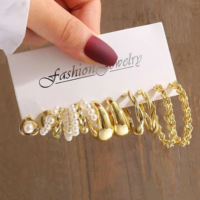 Gold geometric pearl earrings, trendy and party-ready.