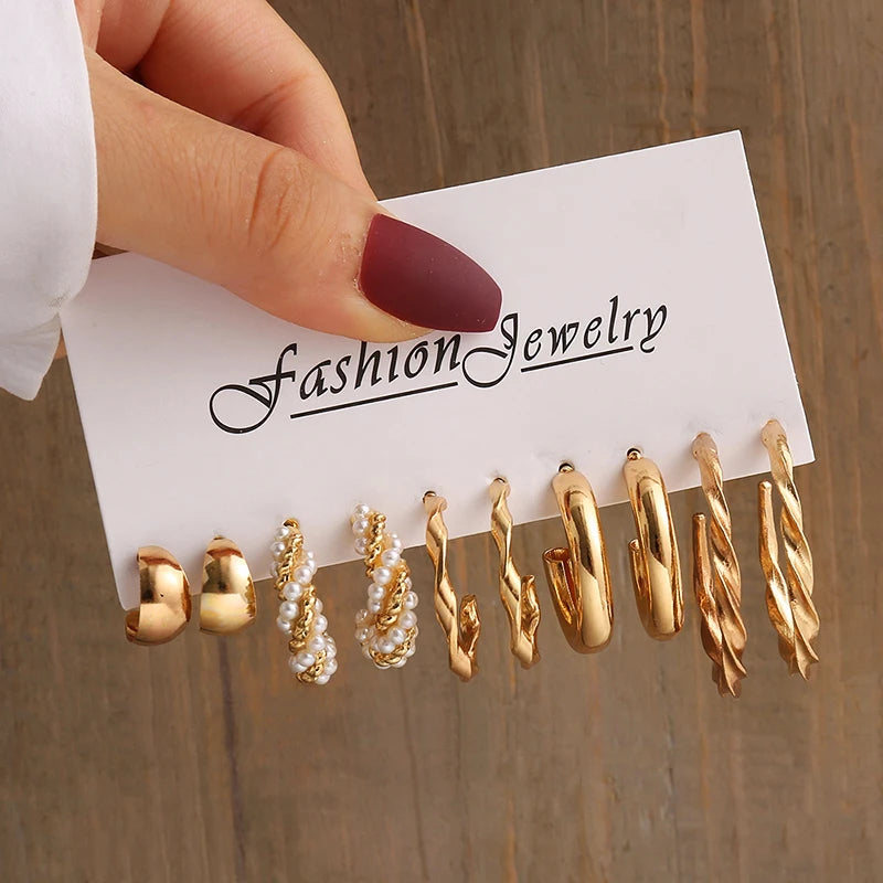 Gold geometric pearl earrings, trendy and party-ready.
