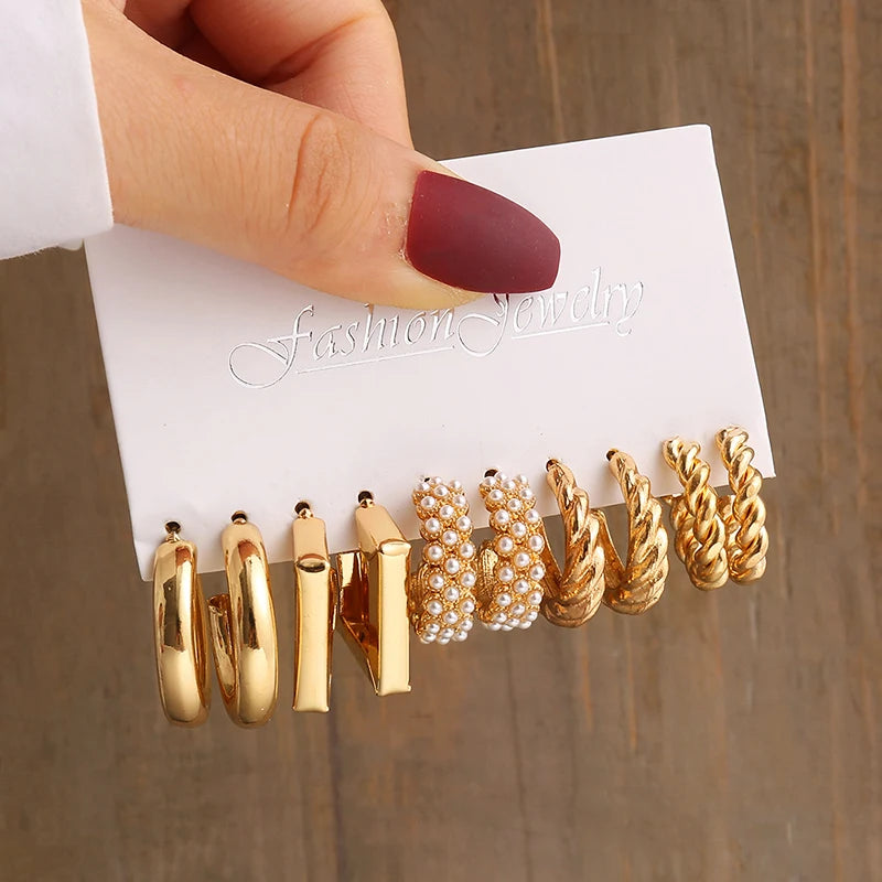 Gold geometric pearl earrings, trendy and party-ready.