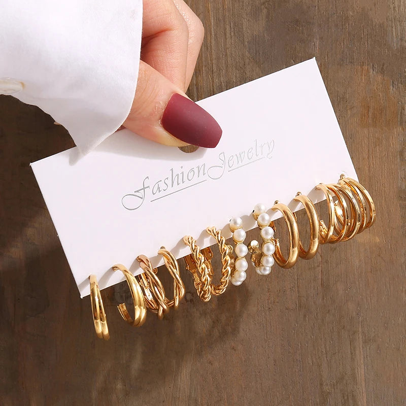 Gold geometric pearl earrings, trendy and party-ready.