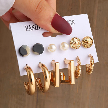 Gold geometric pearl earrings, trendy and party-ready.