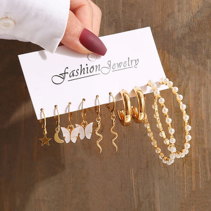 Gold geometric pearl earrings, trendy and party-ready.