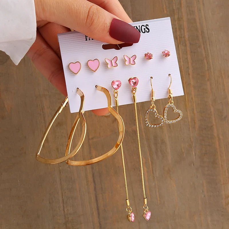 Gold geometric pearl earrings, trendy and party-ready.