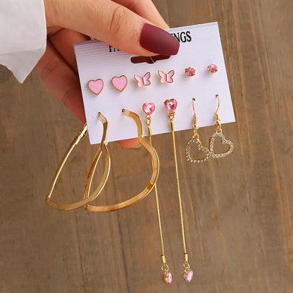 Gold geometric pearl earrings, trendy and party-ready.
