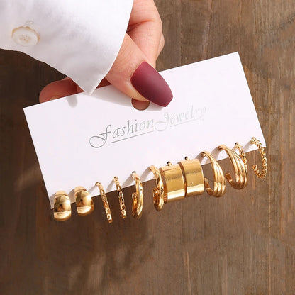 Gold geometric pearl earrings, trendy and party-ready.