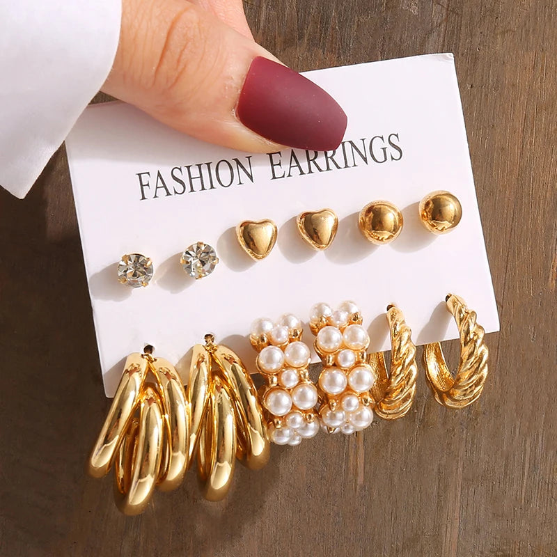Gold geometric pearl earrings, trendy and party-ready.