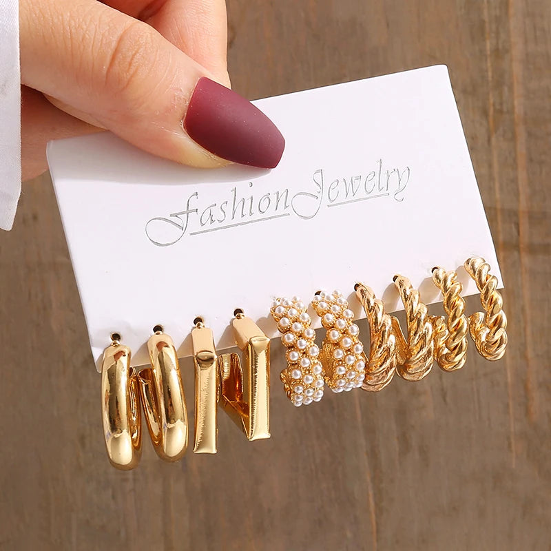 Gold geometric pearl earrings, trendy and party-ready.