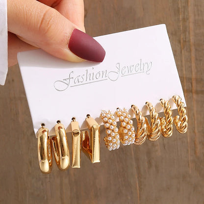 Gold geometric pearl earrings, trendy and party-ready.